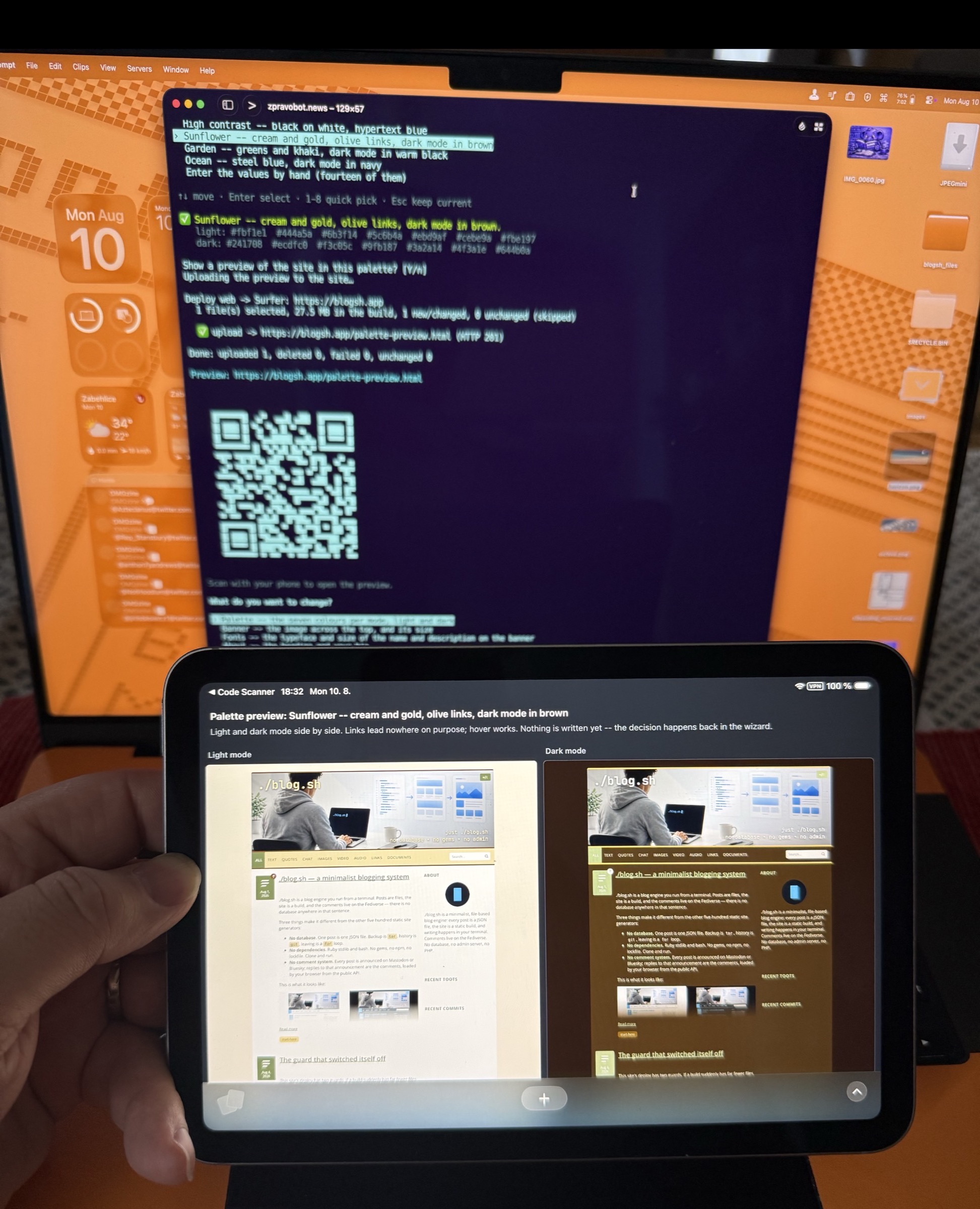 A tablet held in one hand shows the palette preview — the same blog in light and dark mode side by side — with the terminal and its QR code on the laptop screen behind.