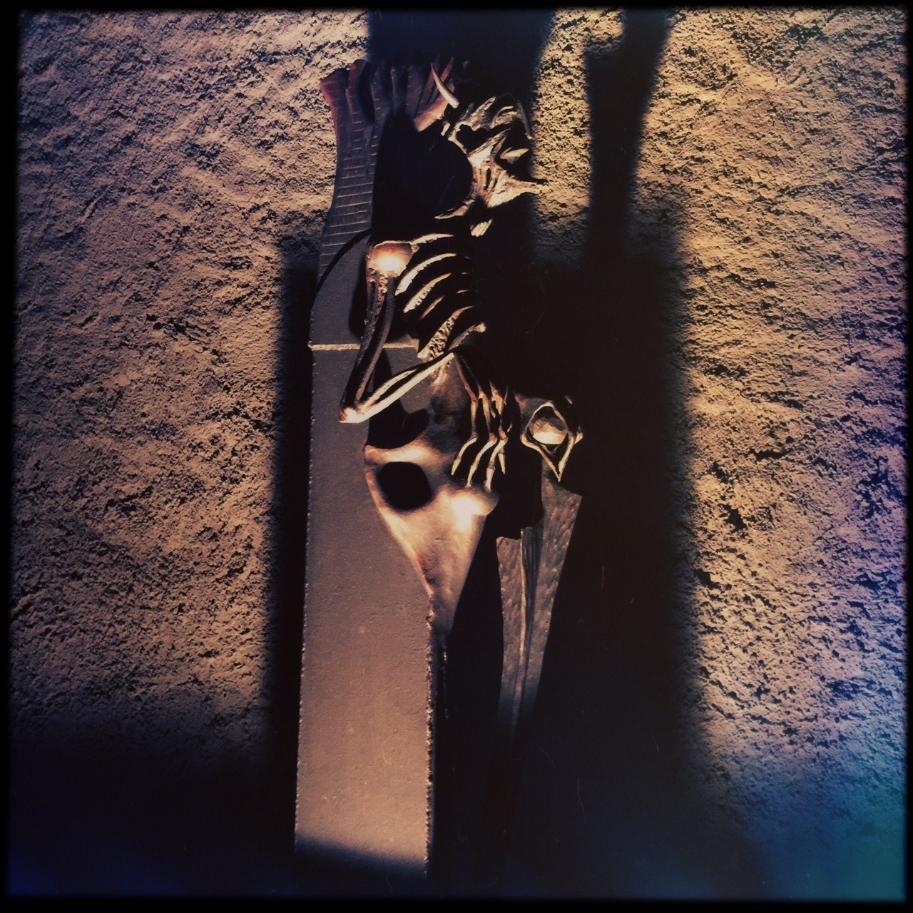 A metal sculpture lit at night